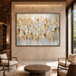 Gilded Fragments artwork displayed above a round table in a softly lit lounge.