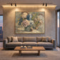 Faded Hydrangeas artwork displayed above a gray sofa beneath track lighting.