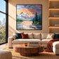 Alpine Afterglow artwork displayed above a sofa and round wooden coffee table.