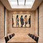 Frontier Silhouettes artwork displayed above a long dining table beneath a skylight.