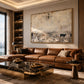 Distant Pasture artwork displayed above a brown leather sofa.
