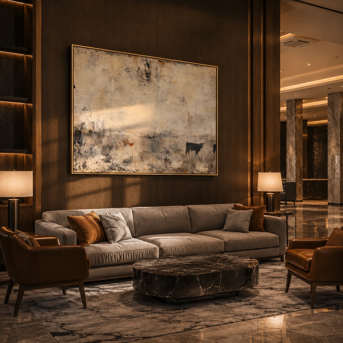 Distant Pasture artwork displayed above a sofa beside illuminated shelves.