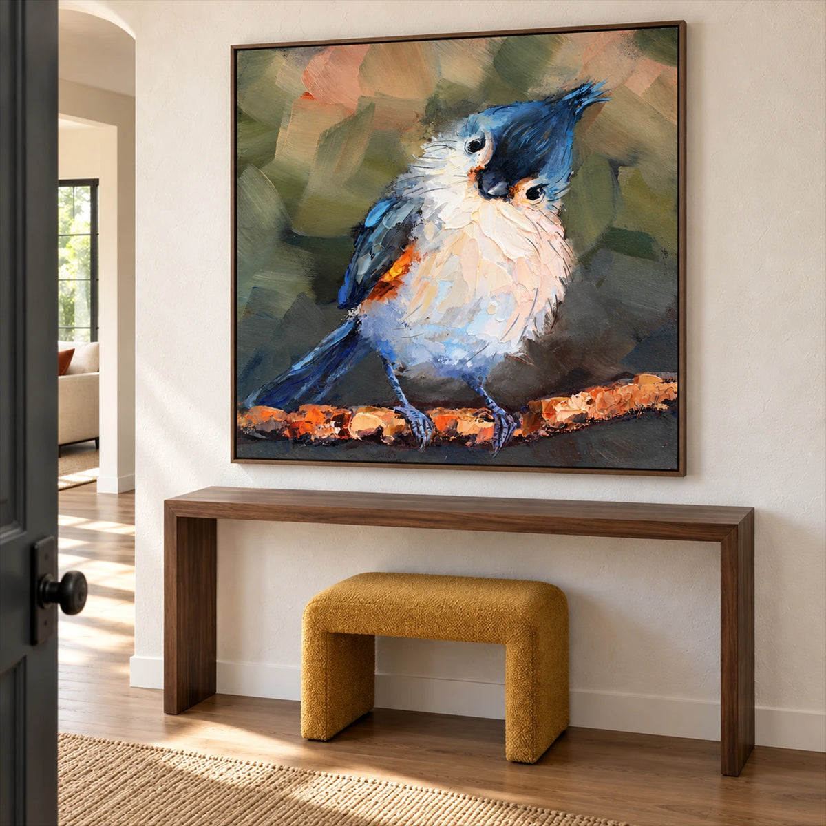 Curious Crest artwork displayed above a console and mustard stool.