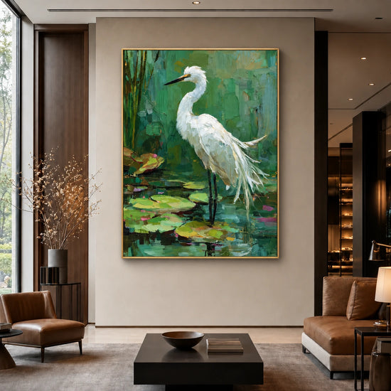 Lilywater Heron Wall Art displayed above seating and a low coffee table in a tall modern living room.