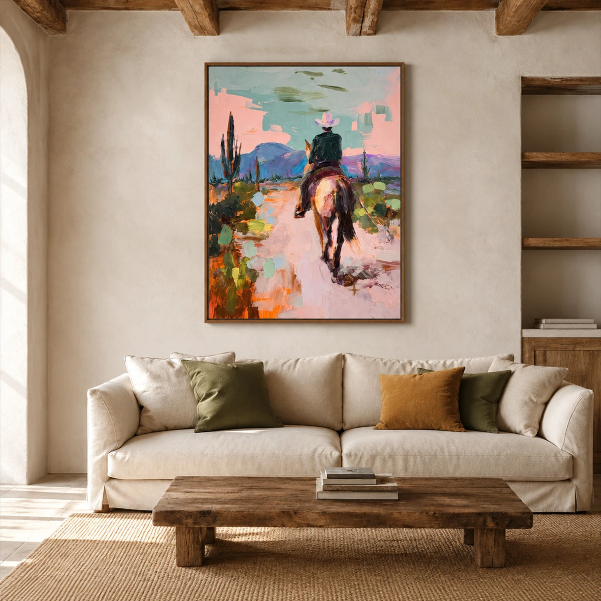 Pastel Outrider artwork displayed above a cream sofa beneath wood beams.