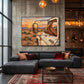 Roadside Repose artwork displayed above a charcoal sofa against a concrete wall.