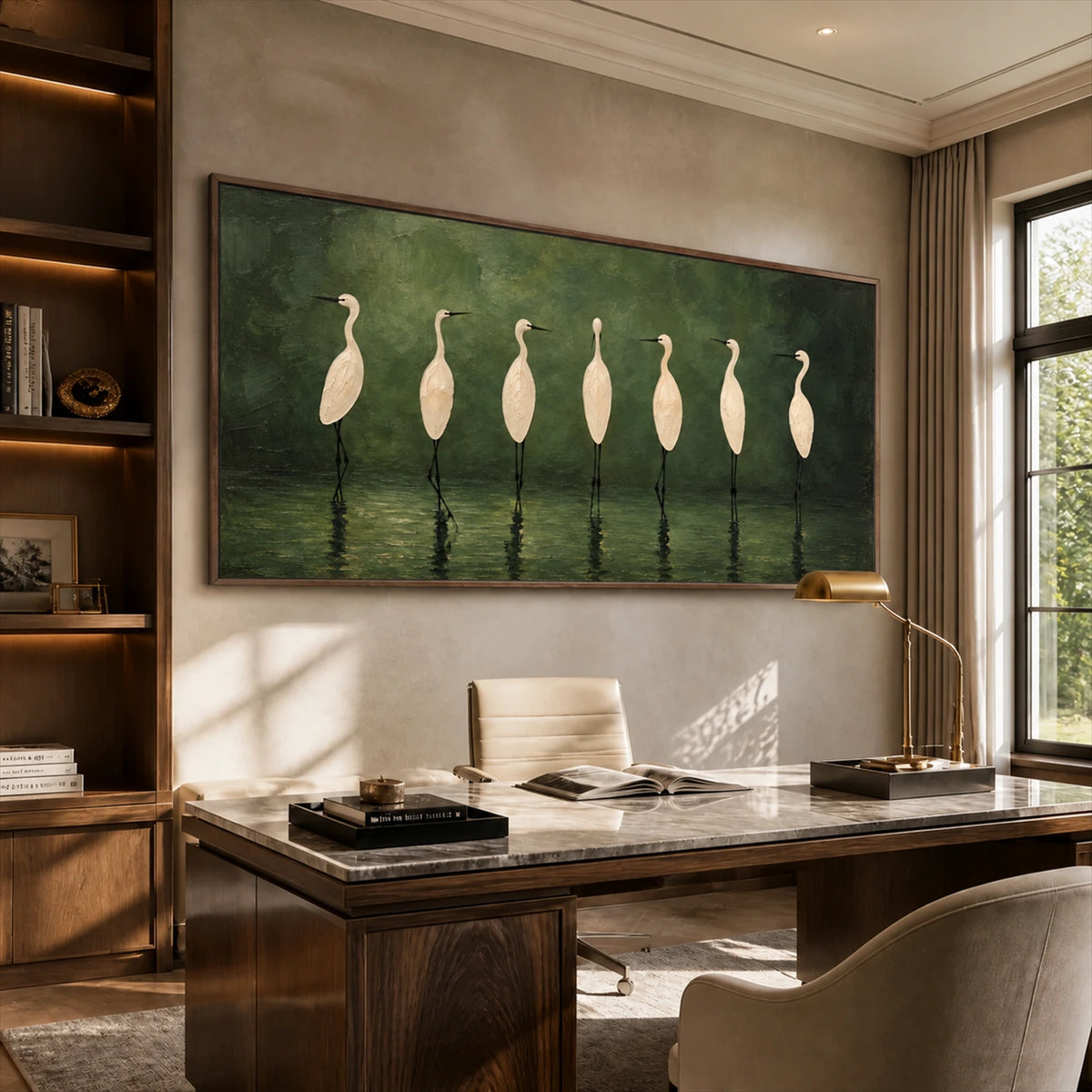 Heron Assembly artwork displayed above a wood desk.