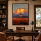 Amber Outrider artwork displayed above a wood desk between bookshelves and a window.