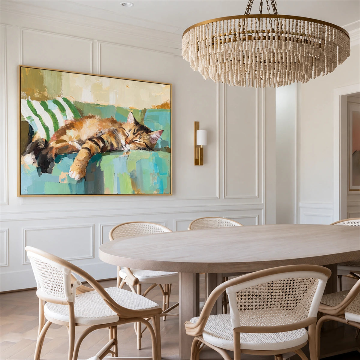 Sofa Slumber artwork displayed beside a dining table beneath a chandelier.