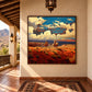 Canyon Riders artwork displayed on a covered terrace overlooking mountains.