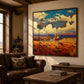 Canyon Riders artwork displayed above a leather sofa in a rustic living room.