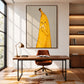 Banana Break artwork displayed above a wooden desk in a home office.