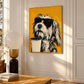 Brew Buddy artwork displayed above a wooden table beside a sculptural lamp.