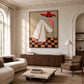 Scarlet Poise artwork displayed above a wood sideboard in a cream living room.