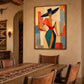 Angular Muse artwork displayed above a rustic dining table with woven chairs.