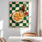 Dino Bites artwork displayed above a table and woven chair in a sunlit room.