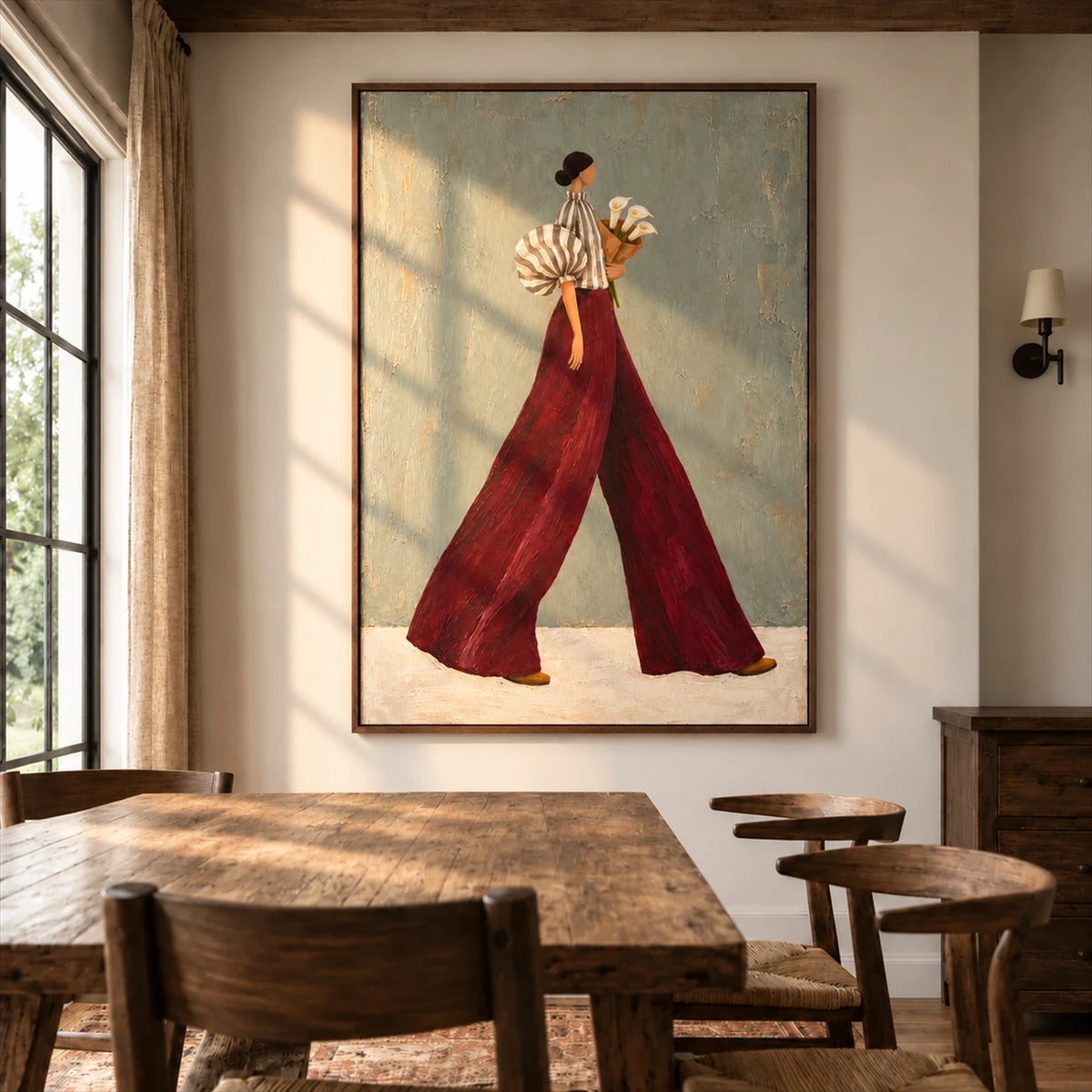 Garnet Stride artwork displayed above a wooden dining table.