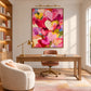 Heart Confetti artwork displayed above a wooden desk beside built-in shelves.