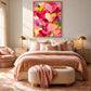 Heart Confetti artwork displayed above a bed with blush bedding.