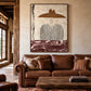 Umber Brim artwork displayed above a brown leather sofa.