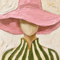 Blush Brim full artwork. A sweeping pink hat shades a softly simplified face above an olive-and-ivory striped blouse.