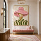 Blush Brim artwork displayed above a pink upholstered bench in an entryway.