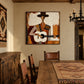 Mesa Ballad artwork displayed beside a wooden dining table.
