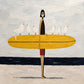 Gull Gathering full artwork. A slender surfer carries a bright yellow board lined with white gulls.