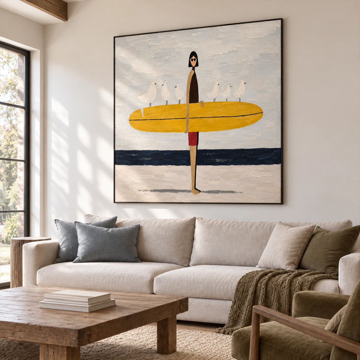Gull Gathering artwork displayed above a cream sofa.