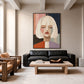 Pastel Stillness artwork displayed above a black leather sofa.