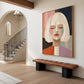 Pastel Stillness artwork displayed above a hallway bench beside an archway.