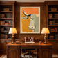 Terra Steer artwork displayed above a desk between bookshelves.