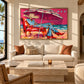 Parasol Escape artwork displayed above a cream sofa in a bright sitting room.