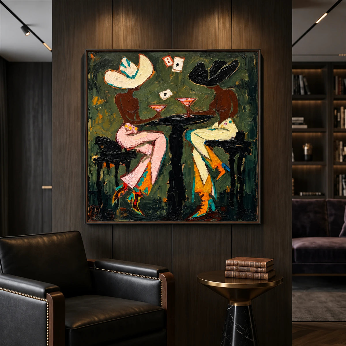 Saloon Suits artwork displayed above leather seating in a dark lounge.