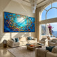 Azure Shoal artwork displayed above a cream sofa in a bright coastal living room.