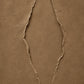 Earthen Fissure full artwork. Two irregular fissures trace an open shape across a warm earthen surface.
