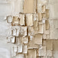 Ivory Strata full artwork. Layered ivory and sand-colored forms gather across a softly weathered surface.