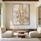 Ivory Strata artwork displayed above cream seating in a sunlit living room.