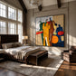 Syncopated Hues artwork displayed beside a bed in a spacious loft.