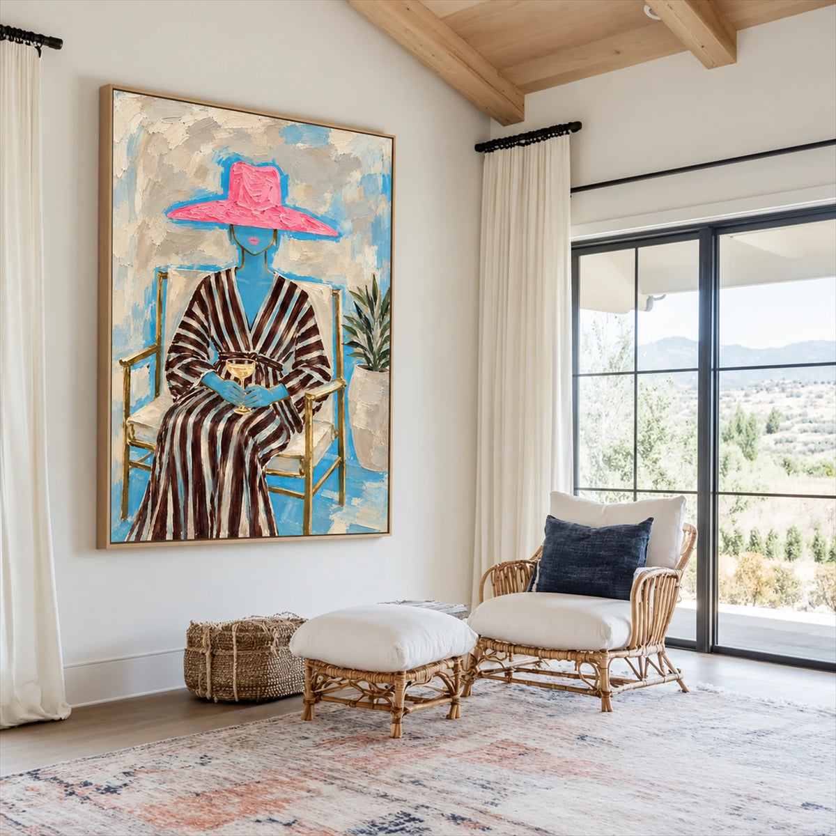 Fuchsia Reverie artwork displayed beside rattan seating in a bright room.