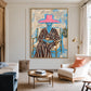 Fuchsia Reverie artwork displayed above round nesting tables in a soft neutral lounge.