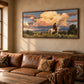 Cloudbound Rider artwork displayed above a leather sofa beside a tall window.