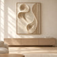 Sculpted Current artwork displayed above a long wooden cabinet in sunlight.