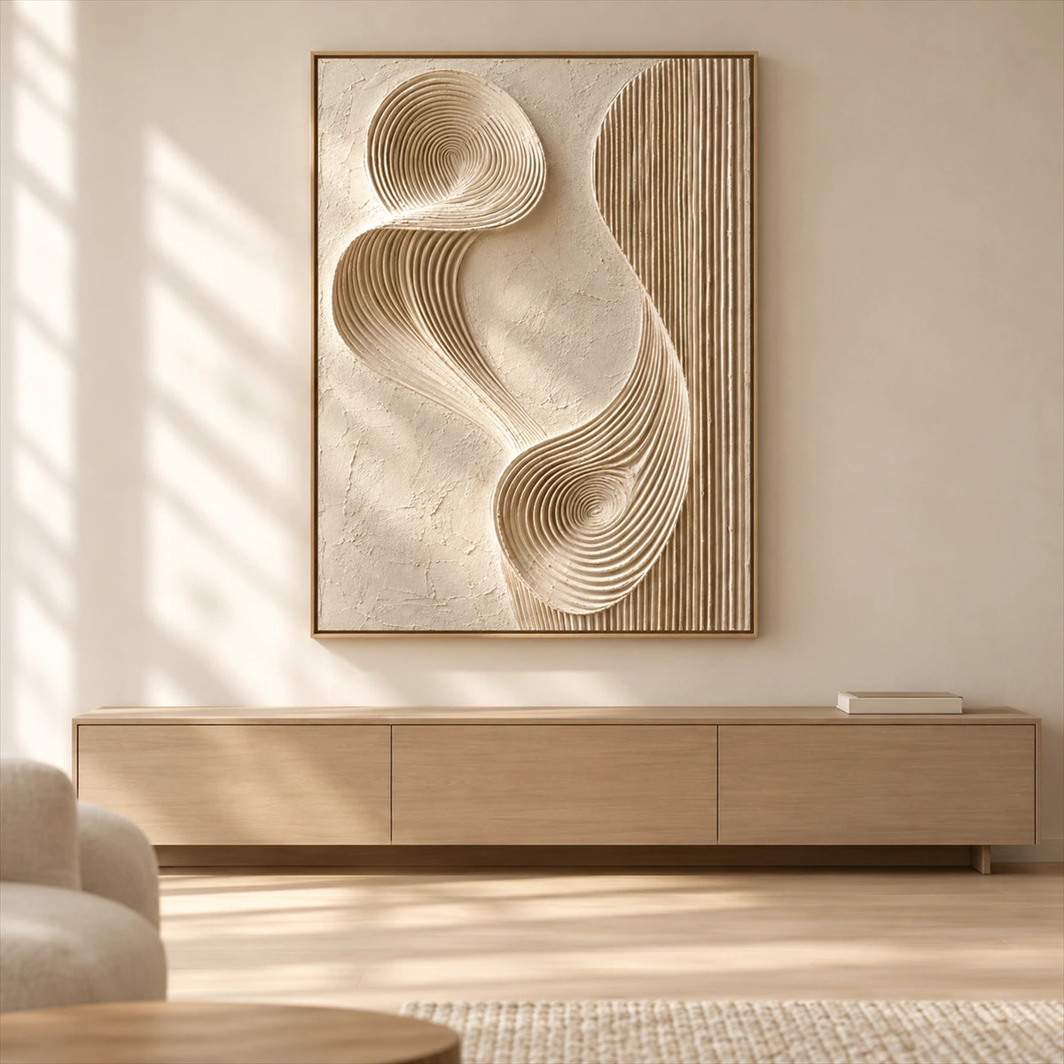 Sculpted Current artwork displayed above a long wooden cabinet in sunlight.