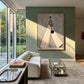 Ivory Stride artwork displayed above a pale sofa against a green accent wall.