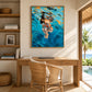 Azure Immersion artwork displayed above a wooden desk and woven chair.