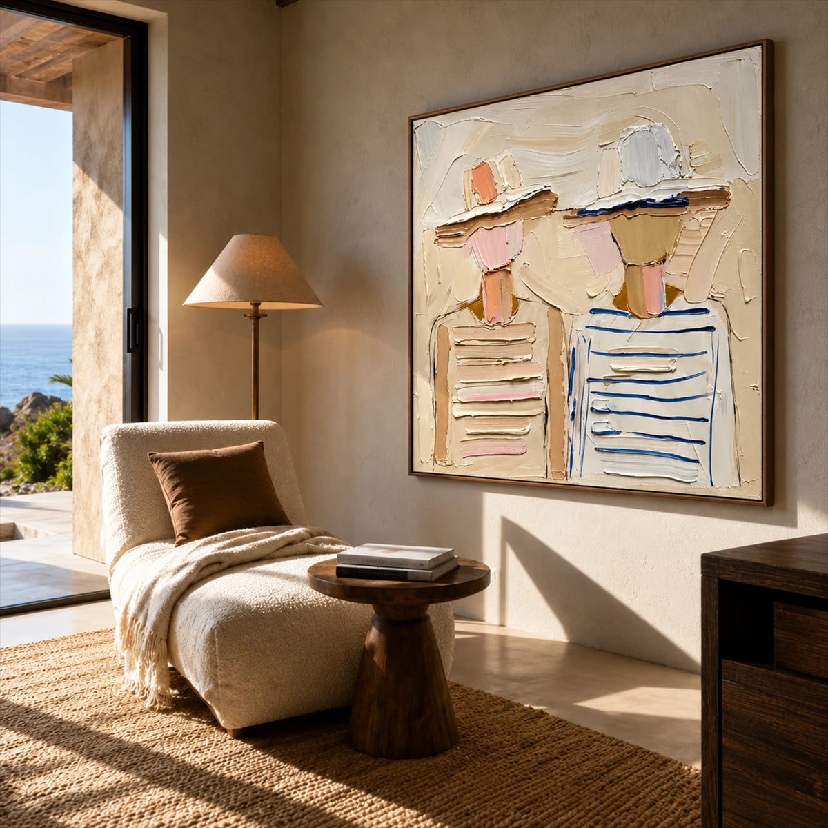 Sunhat Companions artwork displayed beside a chaise lounge facing the coast.