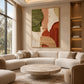 Terracotta Contours artwork displayed above a cream sectional sofa.