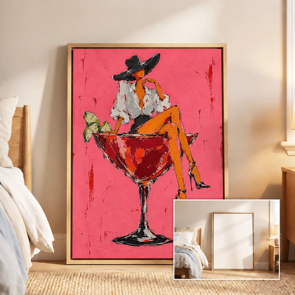 A framed pink Pop Art painting of a woman seated on a cocktail glass in a warm bedroom, with an inset showing the empty frame.