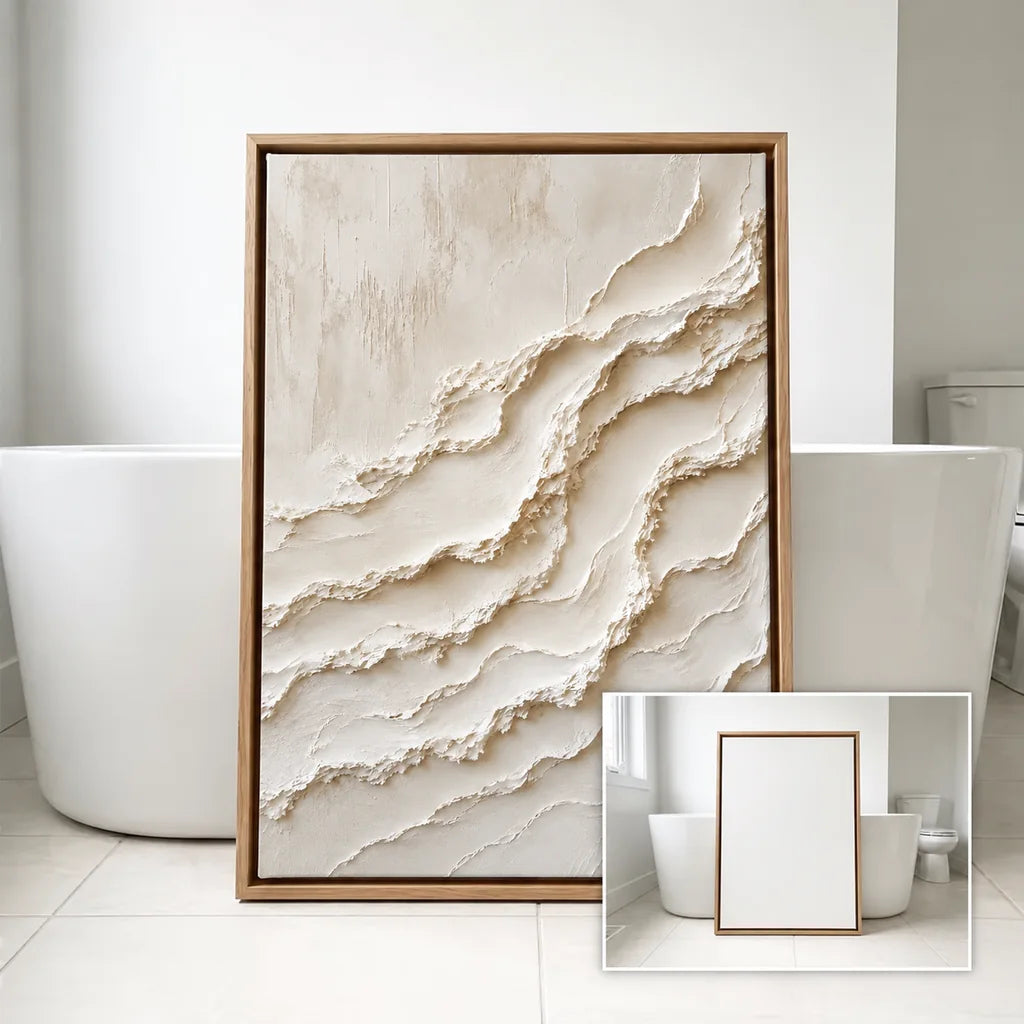 Cream textured painting in a warm wood-colored frame in a light interior.